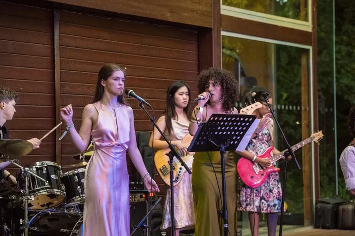 The whole band playing a garden party